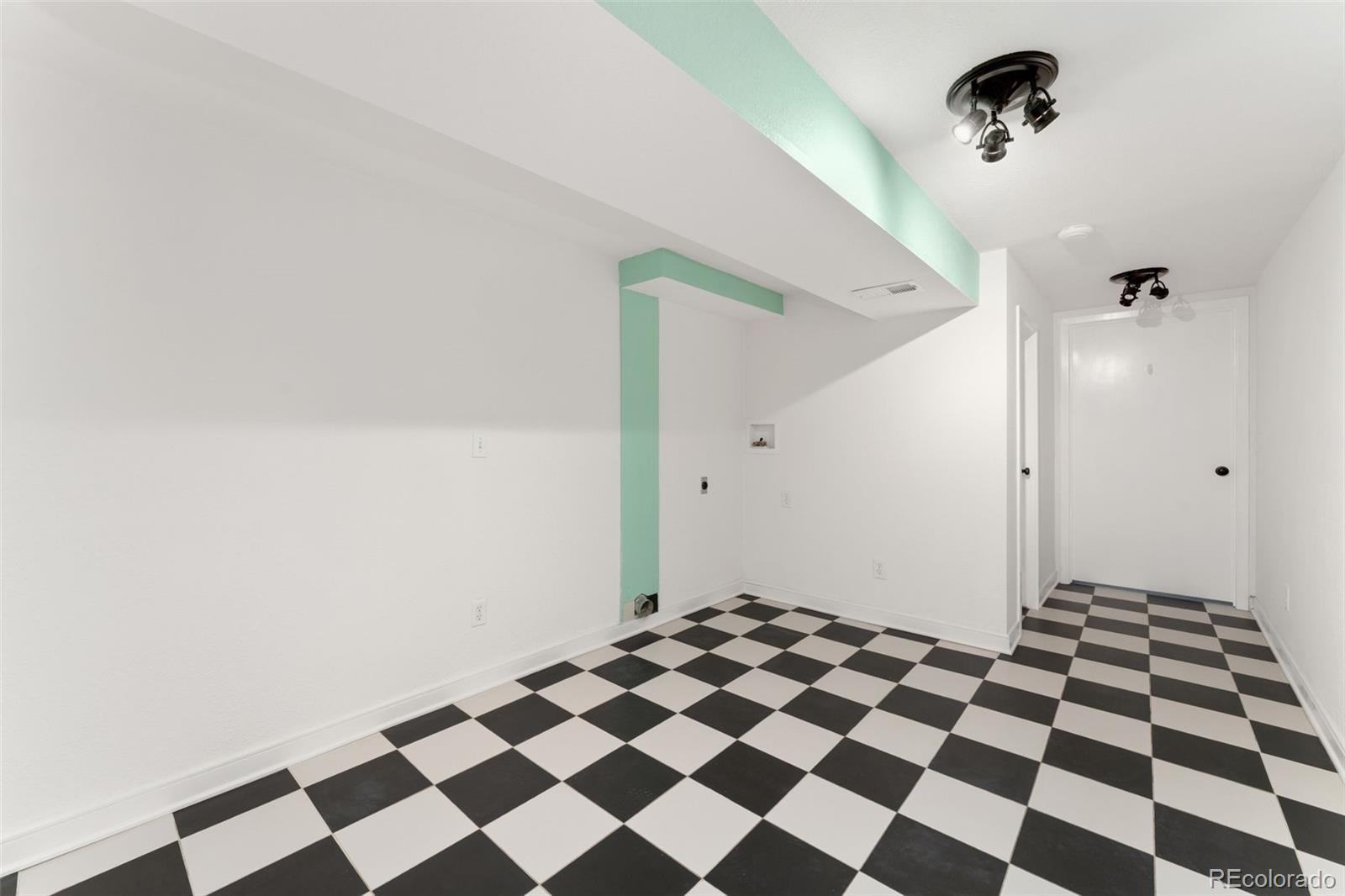 8919 Field Street, Unit 131 Broomfield, CO 80021 - Photo 14 of 27 a view of a room with a black and white checkered floor