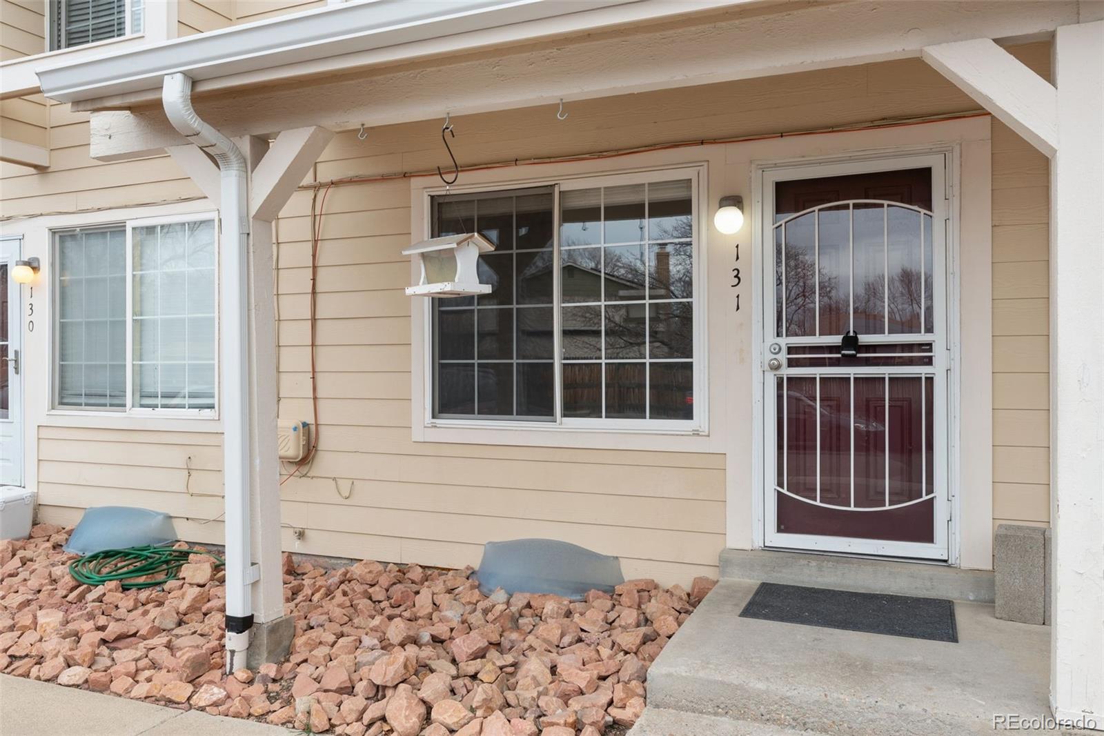 8919 Field Street, Unit 131 Broomfield, CO 80021 - Photo 2 of 27 a front view of a house