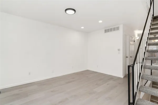a view of entryway with wooden floor