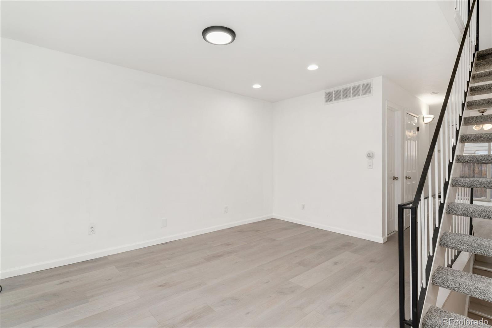 8919 Field Street, Unit 131 Broomfield, CO 80021 - Photo 3 of 27 a view of entryway with wooden floor