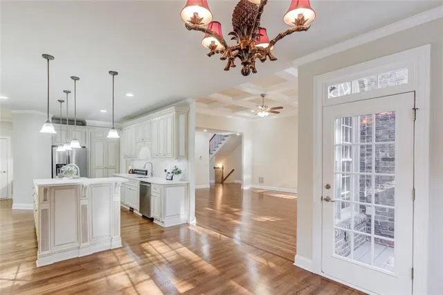 a kitchen with stainless steel appliances granite countertop a sink and refrigerator