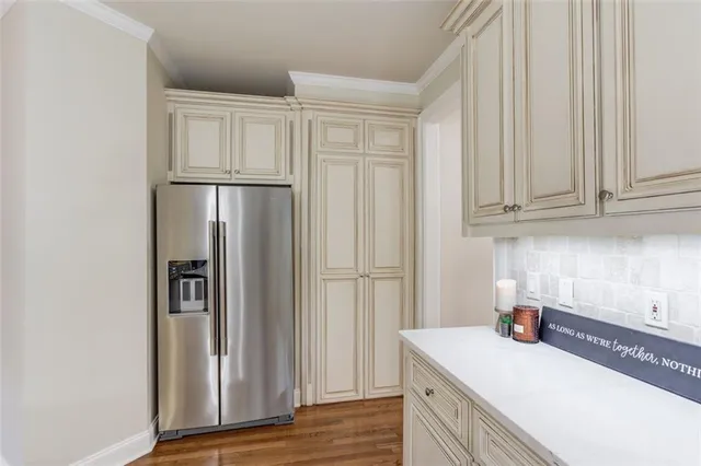 a room with pool table and windows