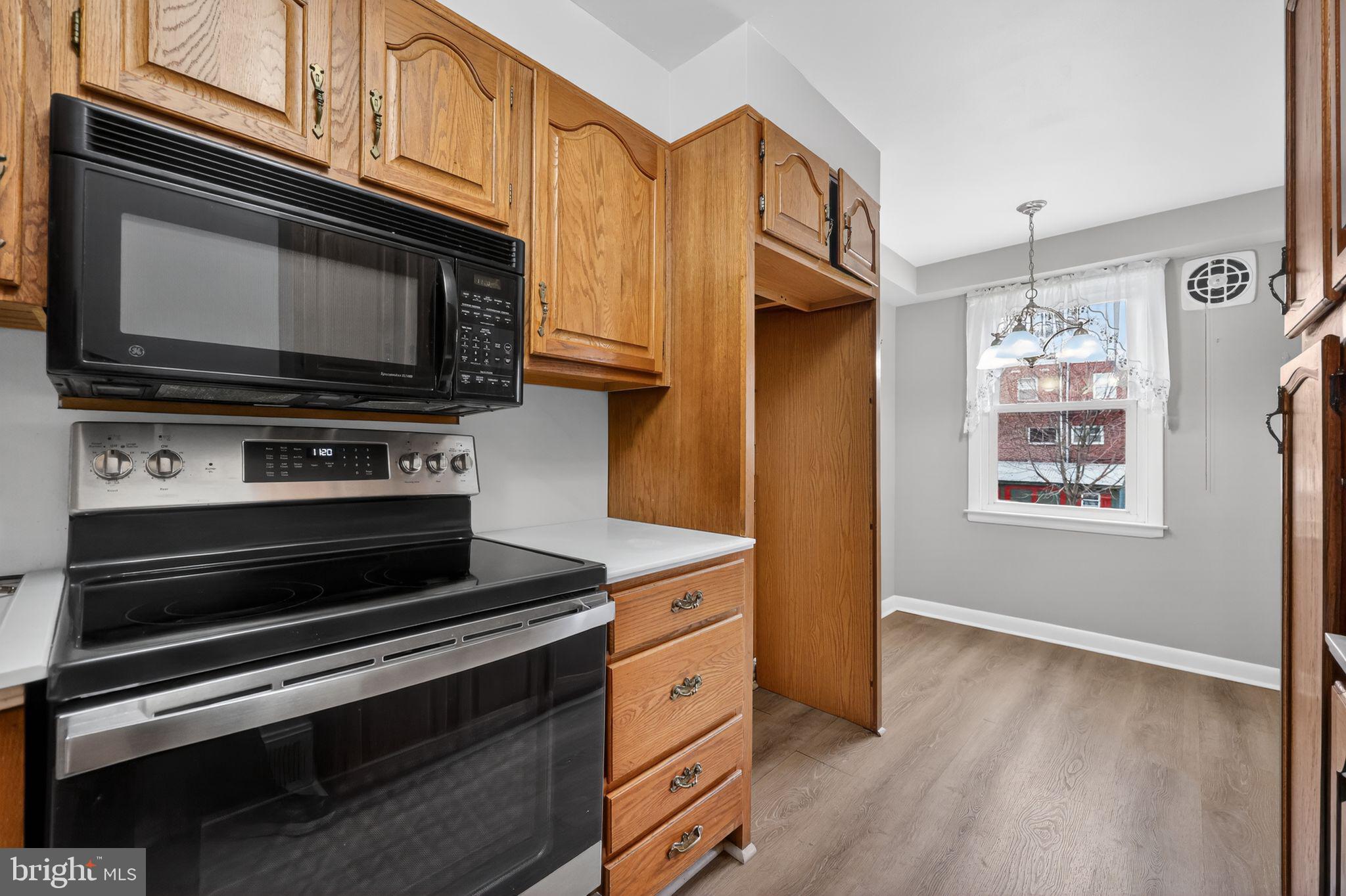 948 Grant Road Folcroft, PA 19032 - Photo 13 of 31 a kitchen with stainless steel appliances a stove and a microwave