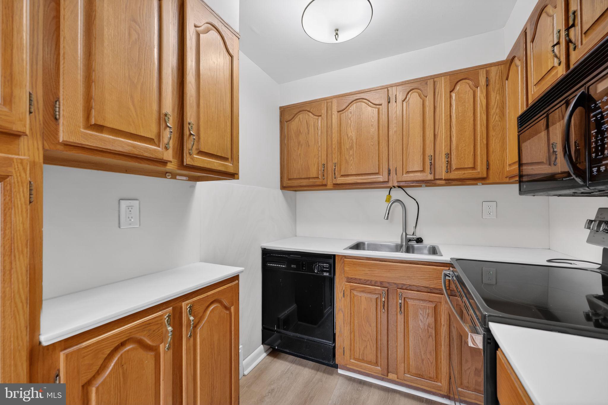 948 Grant Road Folcroft, PA 19032 - Photo 15 of 31 a kitchen with stainless steel appliances granite countertop a sink stove and cabinets