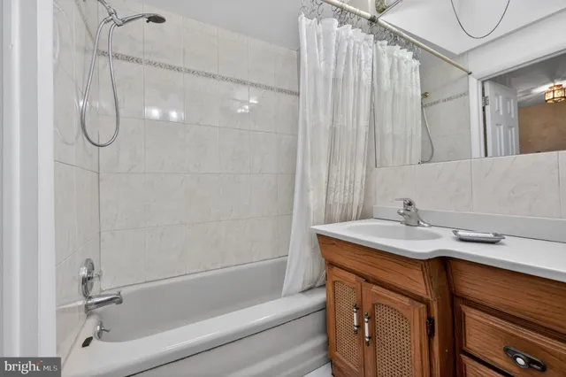 a bathroom with a sink a vanity and a shower