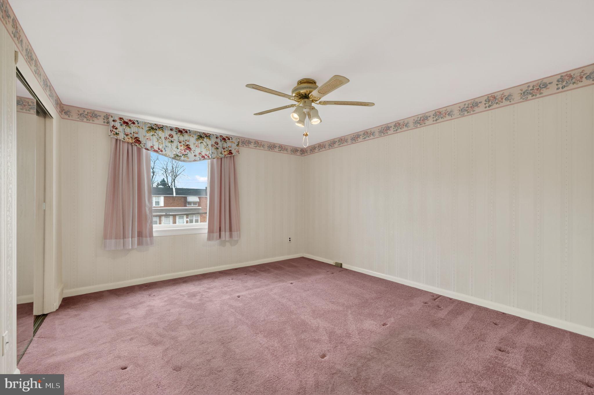 948 Grant Road Folcroft, PA 19032 - Photo 20 of 31 an empty room with windows and fan