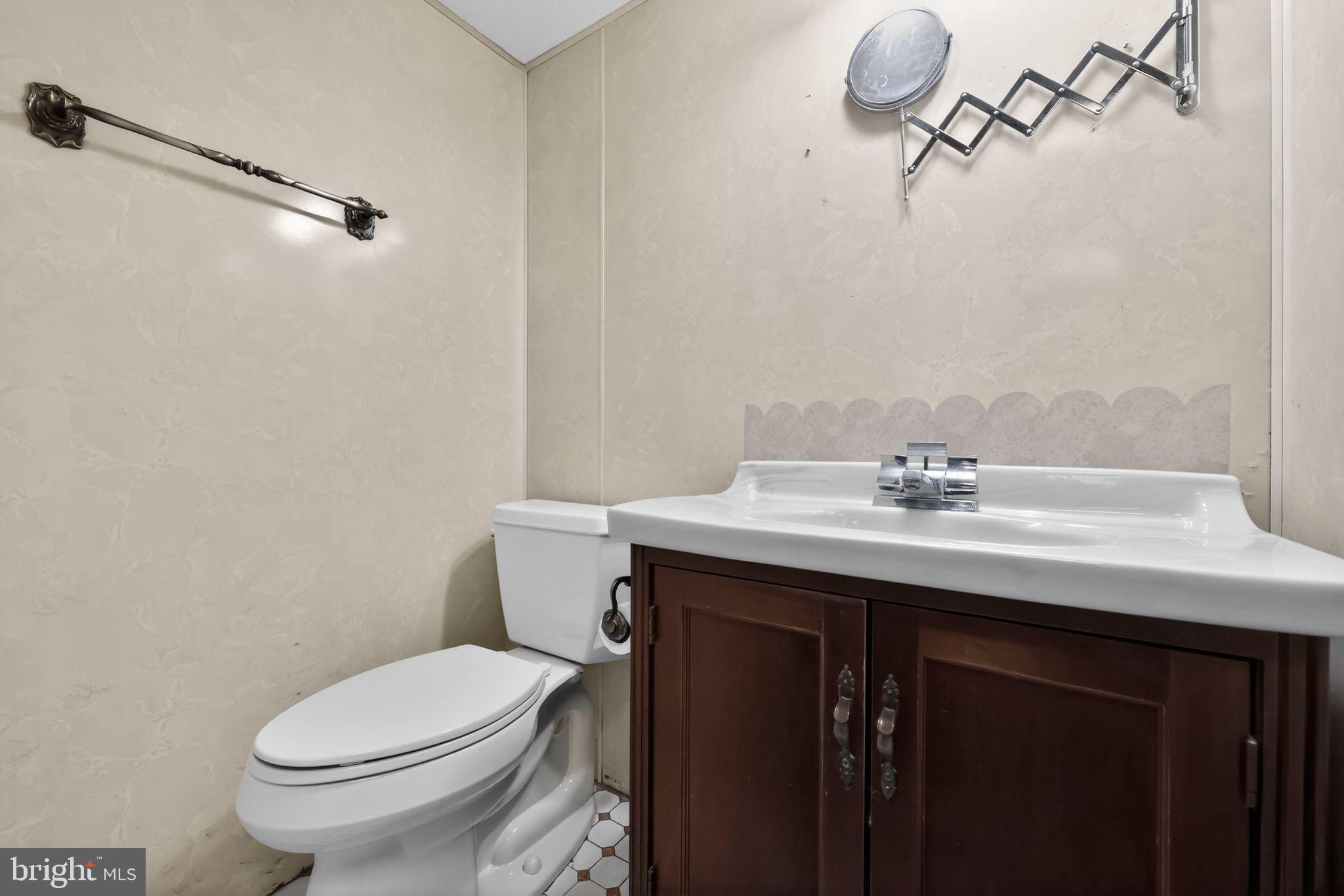 948 Grant Road Folcroft, PA 19032 - Photo 28 of 31 a bathroom with a sink a toilet and shower