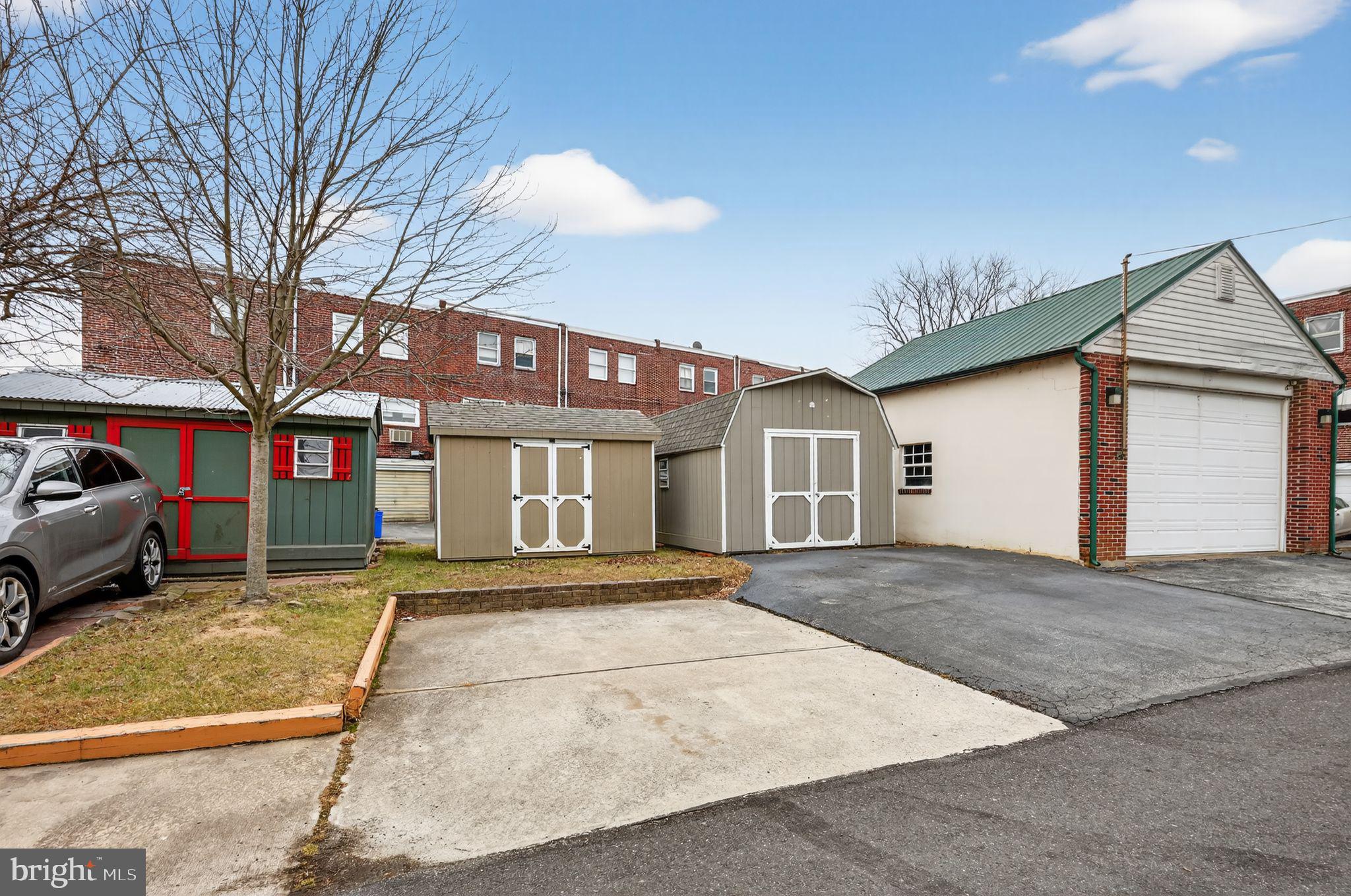948 Grant Road Folcroft, PA 19032 - Photo 6 of 31 a front view of a house with a yard and garage
