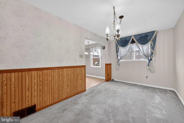 a view of a hallway with a chandelier
