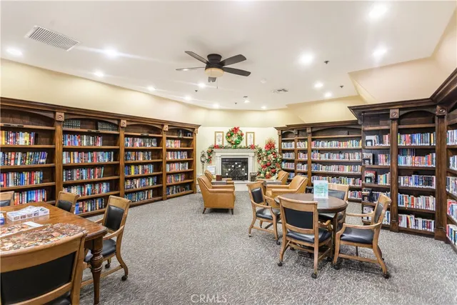 a dining room with furniture and a book shelf