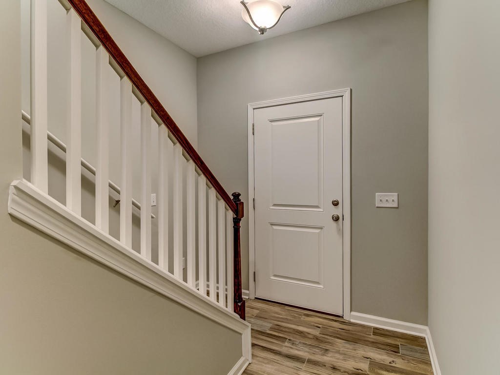 87271 Lents Road Yulee, FL 32097 - Photo 10 of 32 a view of staircase with lots of white walls