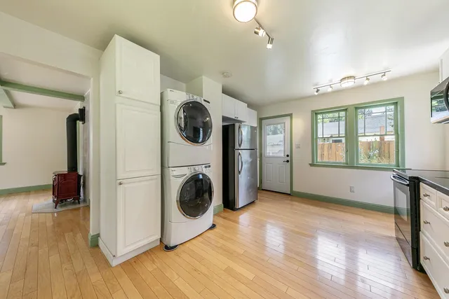 a view of a hallway with washer and dryer