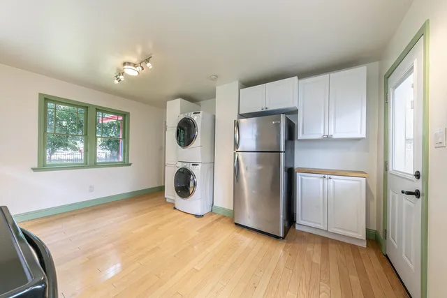 a kitchen with refrigerator and microwave