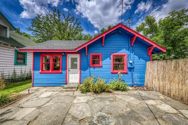 a front view of a house with garden