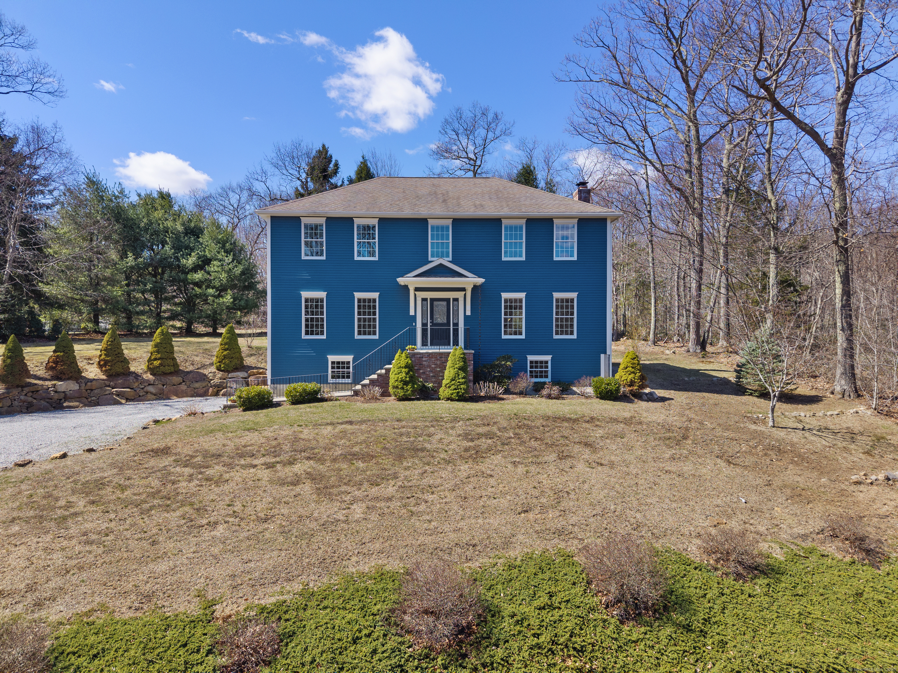 a front view of a house with a yard