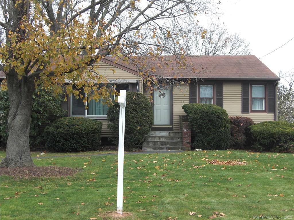 42 Old Stagecoach Road Meriden, CT 06450 - Photo 1 of 1 a backyard of a house with potted plants and large tree