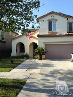 1889 Ribera Drive Oxnard, CA 93030 - Photo 1 of 22 a front view of a house with garden
