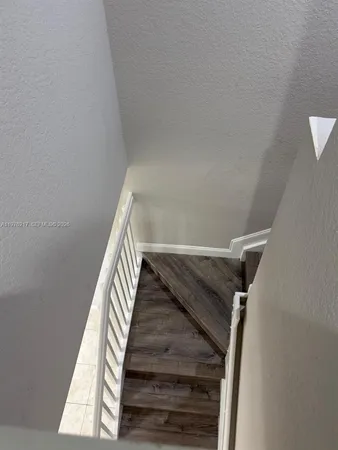a view of wooden floor and staircase