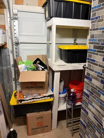 a view of a room with a table and chairs