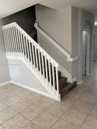 a view of a livingroom with kitchen and furniture