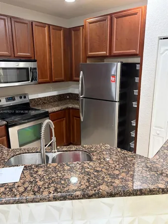 an empty room with wooden floor and a window