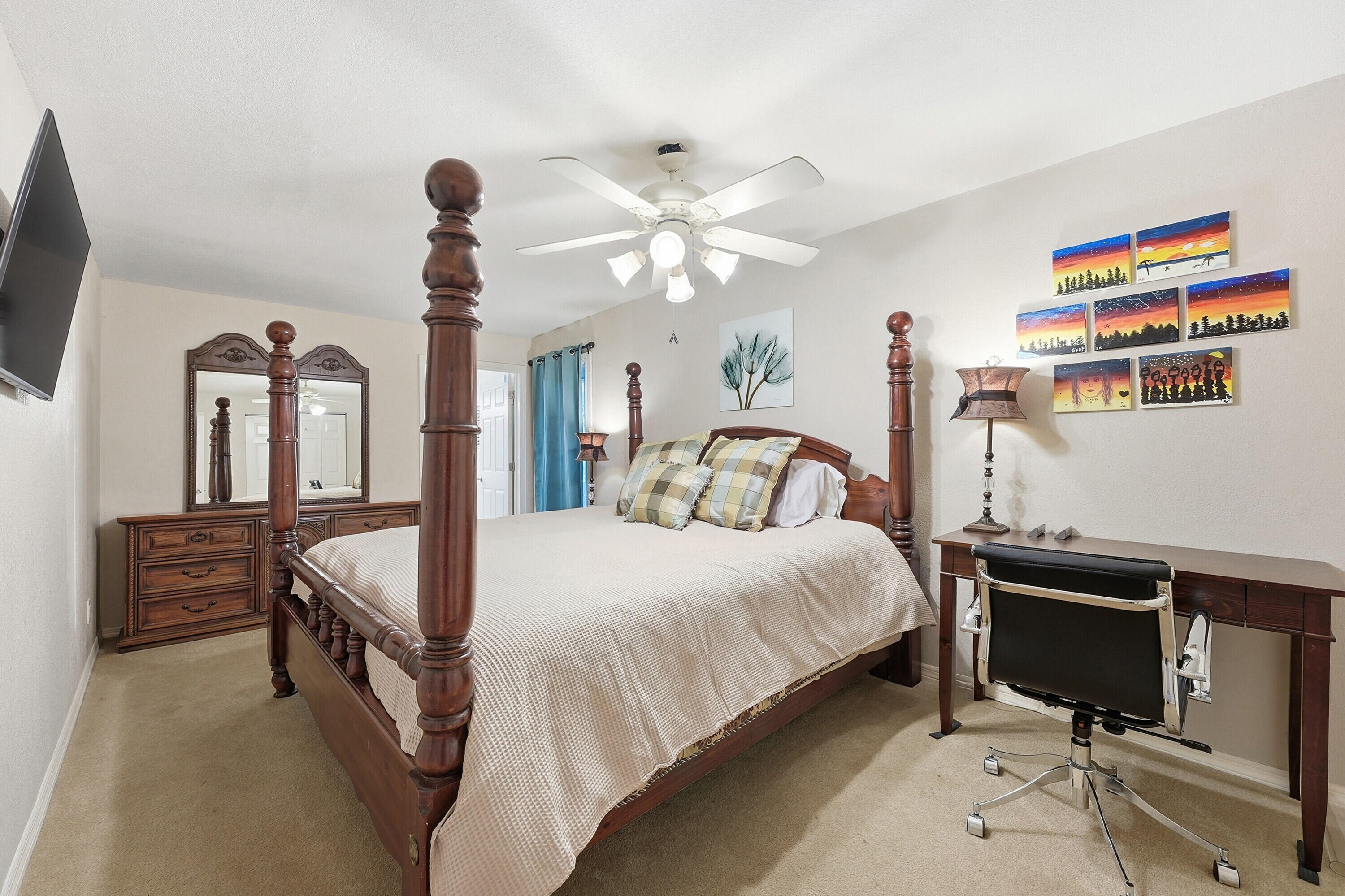 200 Windy Point Road Lake Placid, FL 33852 - Photo 12 of 74 a bedroom with a bed and a chandelier