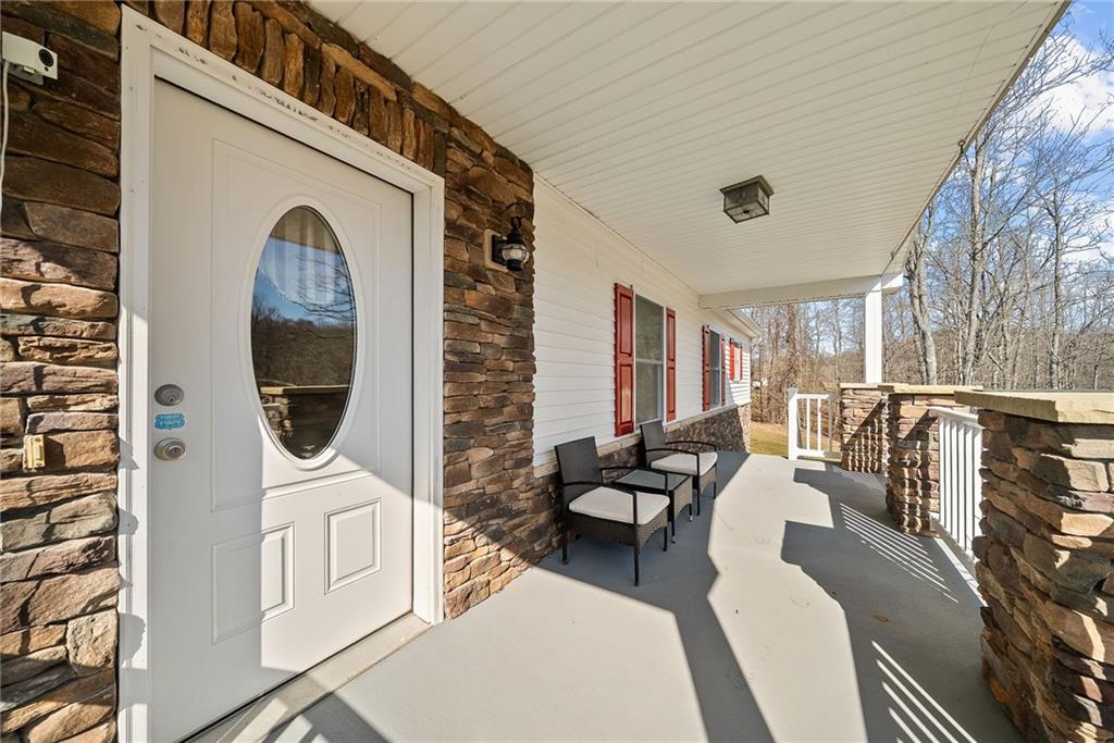 185 Dutch Glory Road Amity, PA 15311 - Photo 13 of 50 Enjoy evening sun on your front porch.