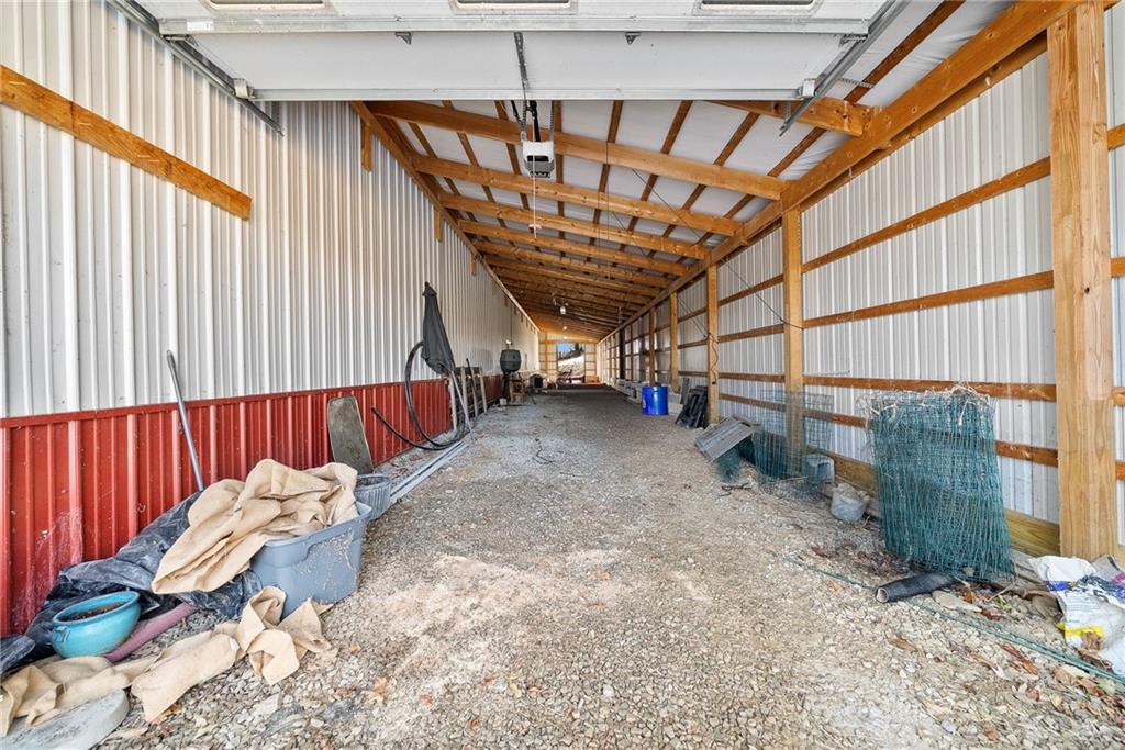 185 Dutch Glory Road Amity, PA 15311 - Photo 6 of 50 Inside 11x100 lean to on side of Multi-Purpose Building - Garage doors on both sides