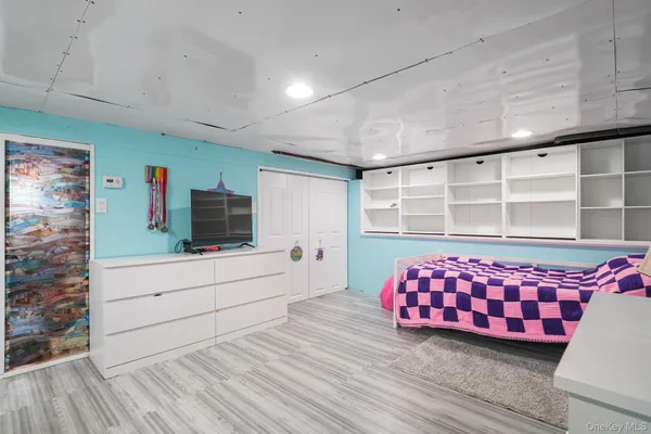 a room with furniture and flat screen tv