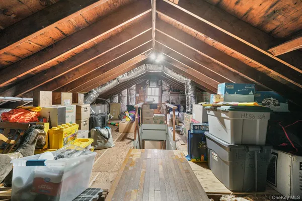 a view of a room with wooden floor and furniture