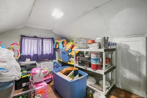 a view of an empty room with closet