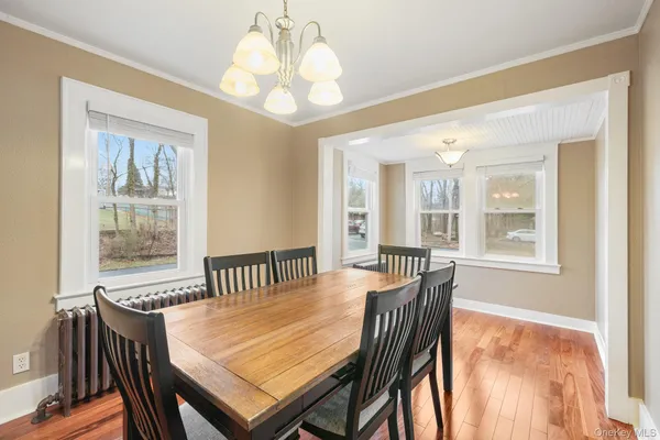 a view of a dining room with furniture window and outside view