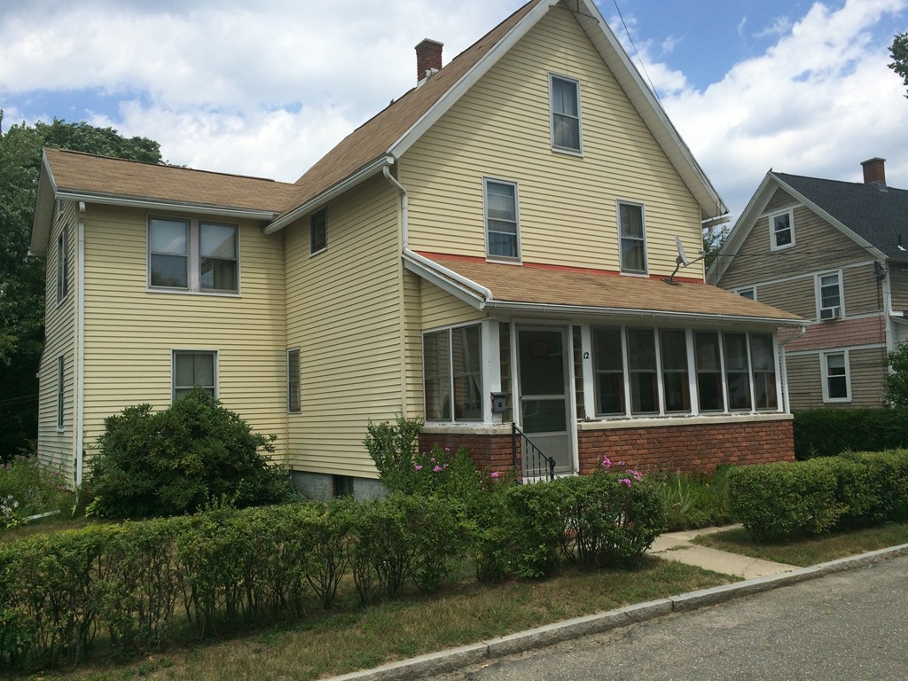 12 Frontenac Street Springfield, MA 01151 - Photo 2 of 9 a view of a white house next to a yard