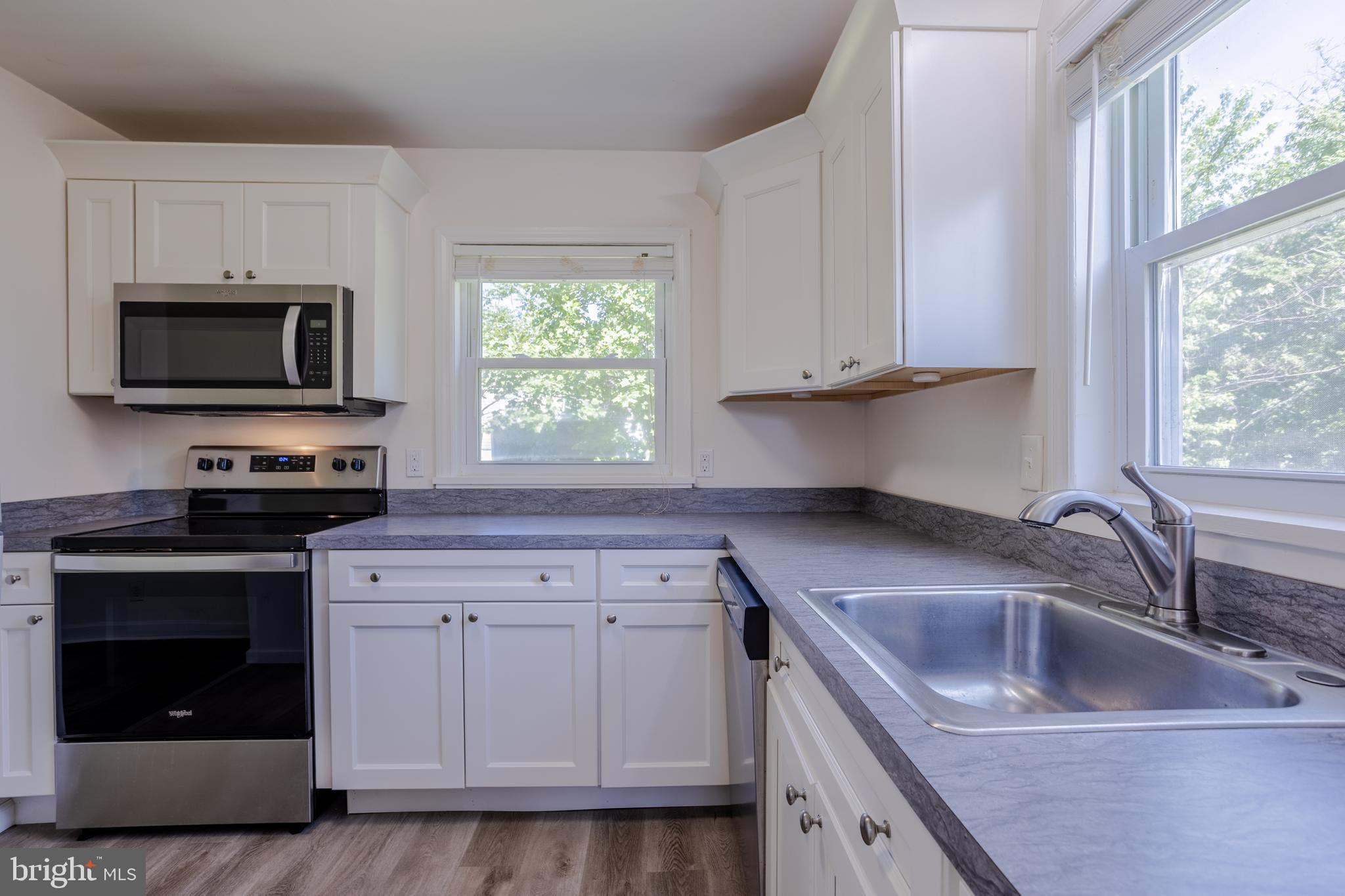 3612 Churchville Road Aberdeen, MD 21001 - Photo 10 of 49 a kitchen with appliances a sink and a stove