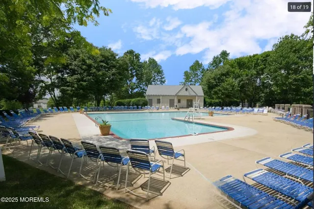 a swimming pool view with a outdoor space