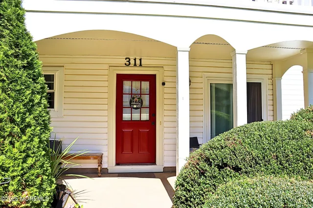 a view of front of house with potted plants