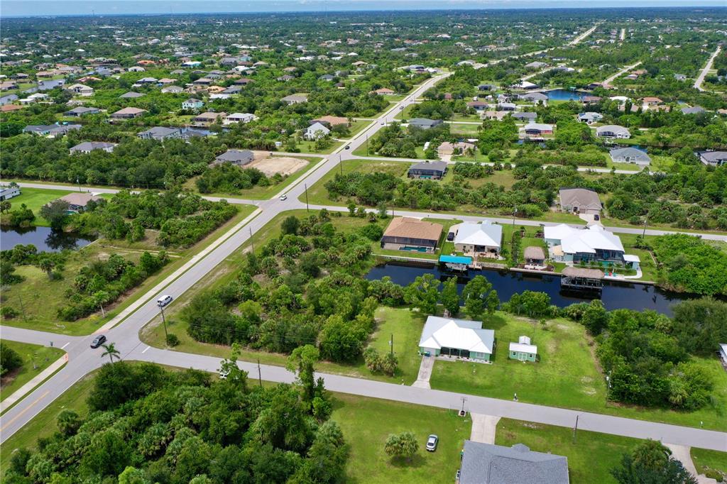9150 Snapper Circle Port Charlotte, FL 33981 - Photo 13 of 27 an aerial view of residential houses with outdoor space and trees