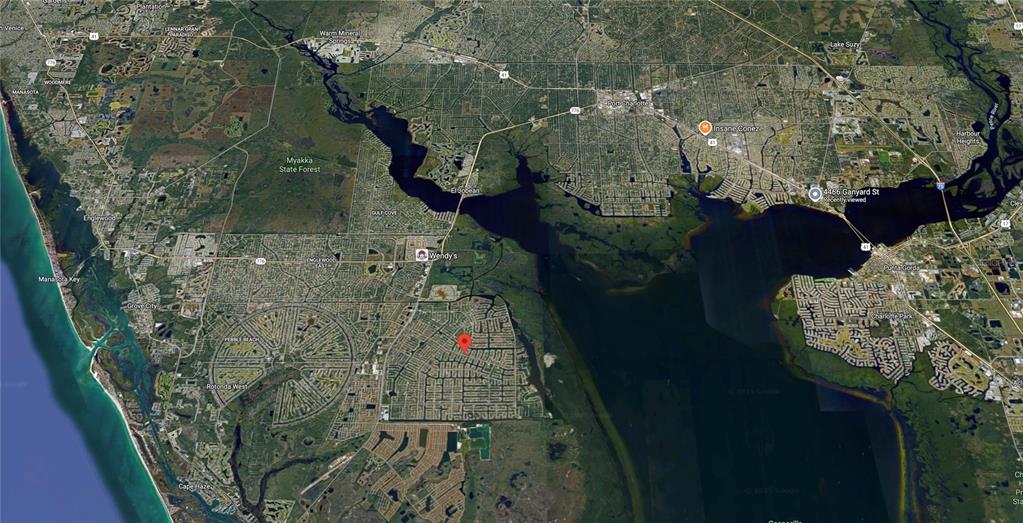 9150 Snapper Circle Port Charlotte, FL 33981 - Photo 25 of 27 an aerial view of a house