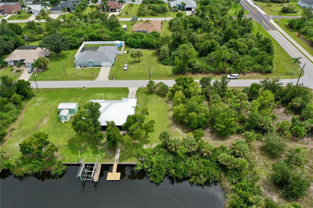 9150 Snapper Circle Port Charlotte, FL 33981 - Photo 6 of 27 an aerial view of house with yard swimming pool and outdoor seating