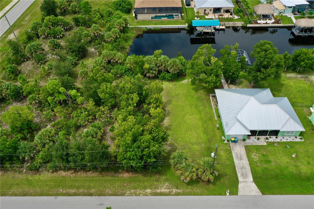 9150 Snapper Circle Port Charlotte, FL 33981 - Photo 8 of 27 an aerial view of a house with a garden and lake view
