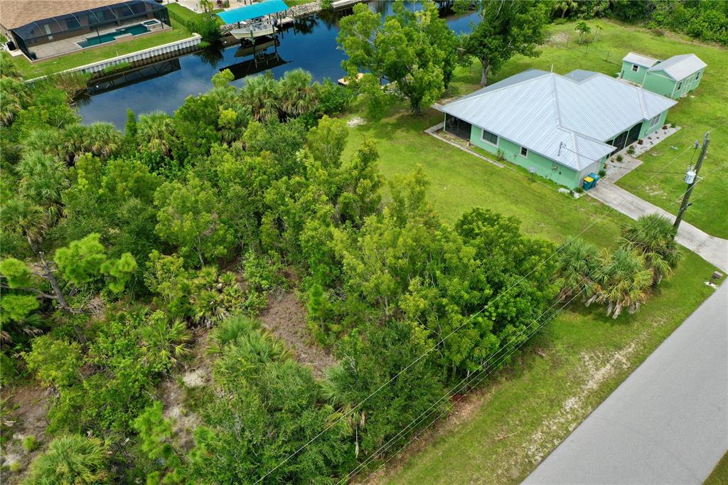9150 Snapper Circle Port Charlotte, FL 33981 - Photo 9 of 27 view of a house with a yard