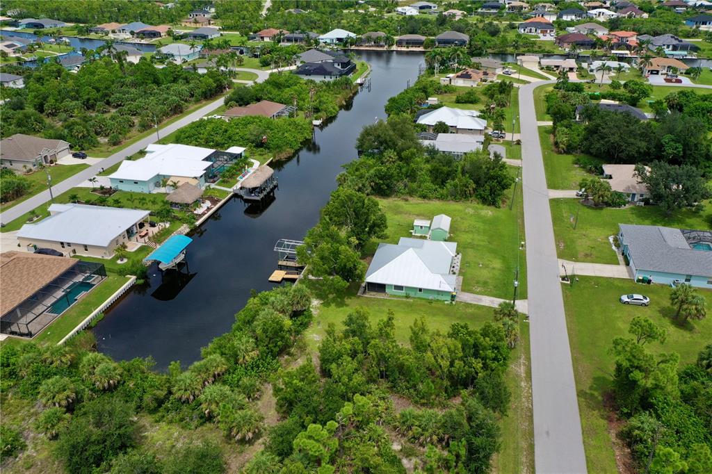 9150 Snapper Circle Port Charlotte, FL 33981 - Photo 10 of 27 an aerial view of multiple houses with yard