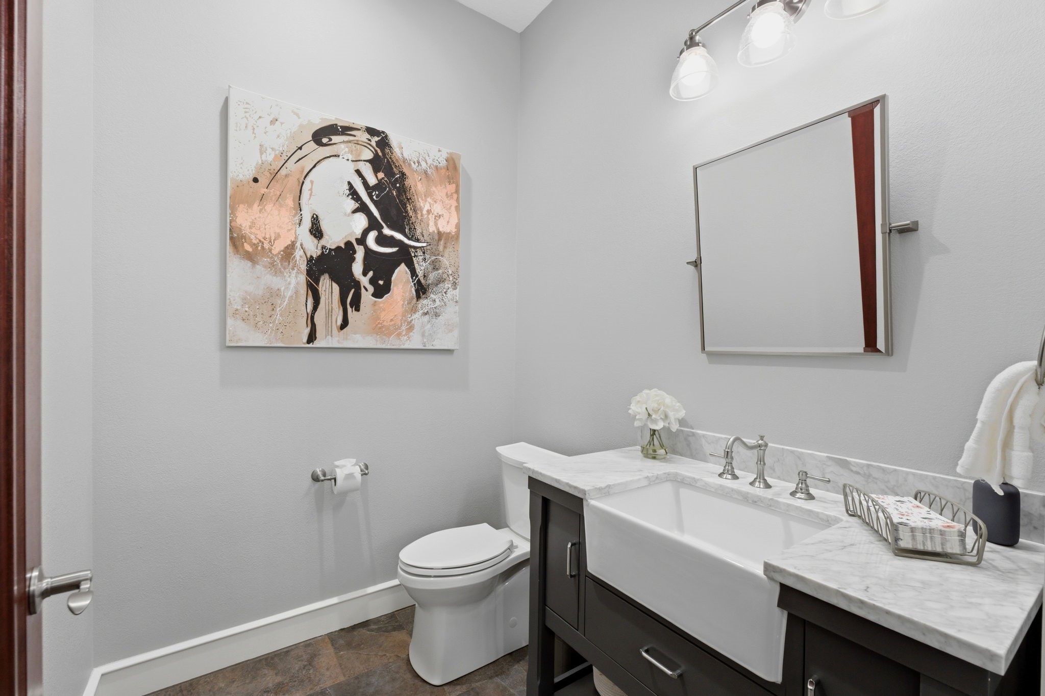 280 Sundog Road Huntsville, TX 77340 - Photo 21 of 50 Well-appointed powder room with an elegant vanity and marble countertops.