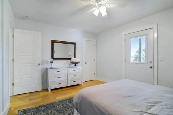 a bedroom with a bed and a dresser