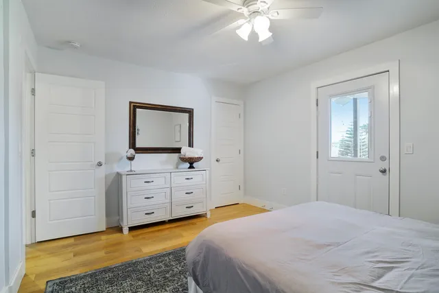a bedroom with a bed and a dresser