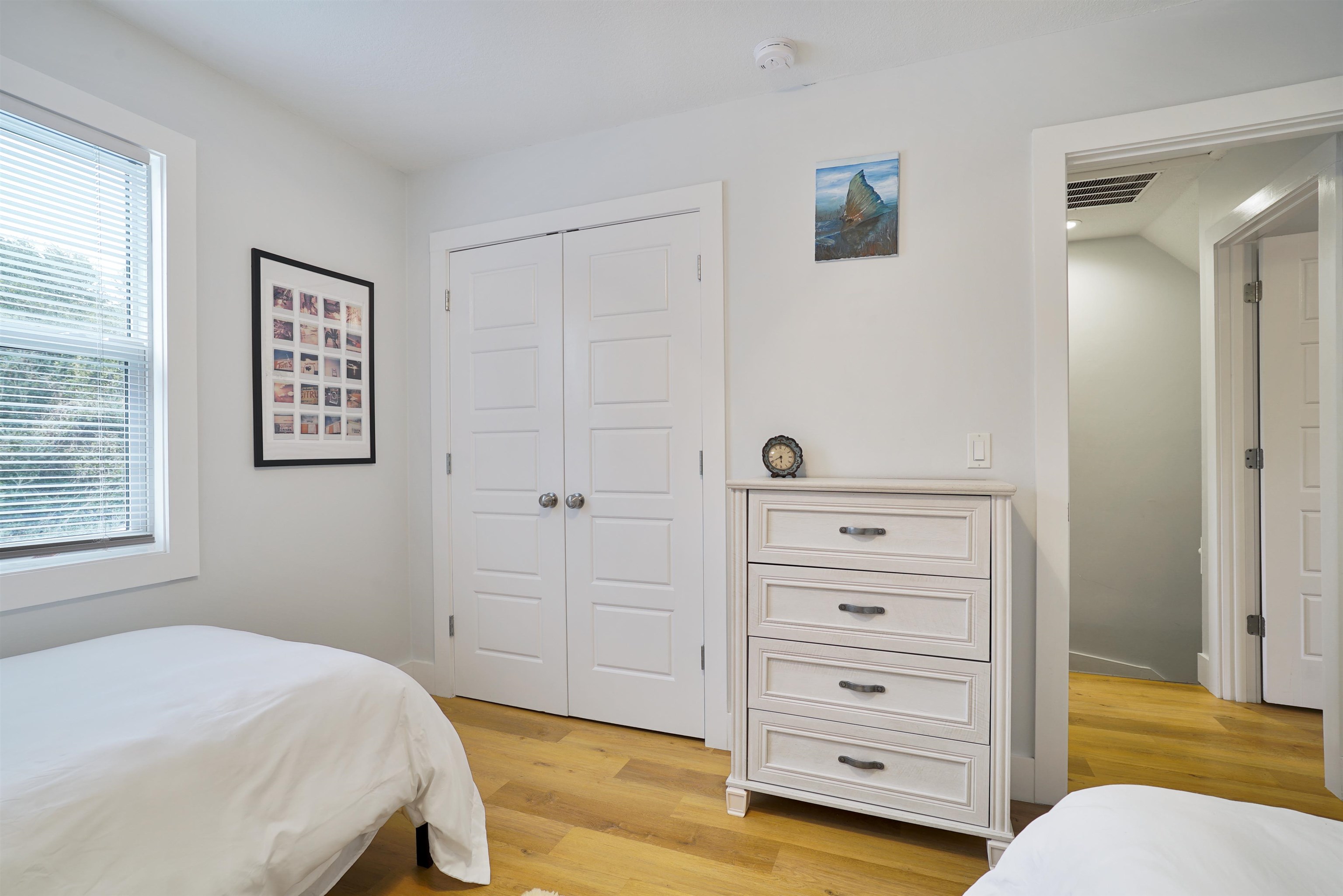 112 E Street St. Augustine, FL 32080 - Photo 16 of 41 a bedroom with a bed and a dresser