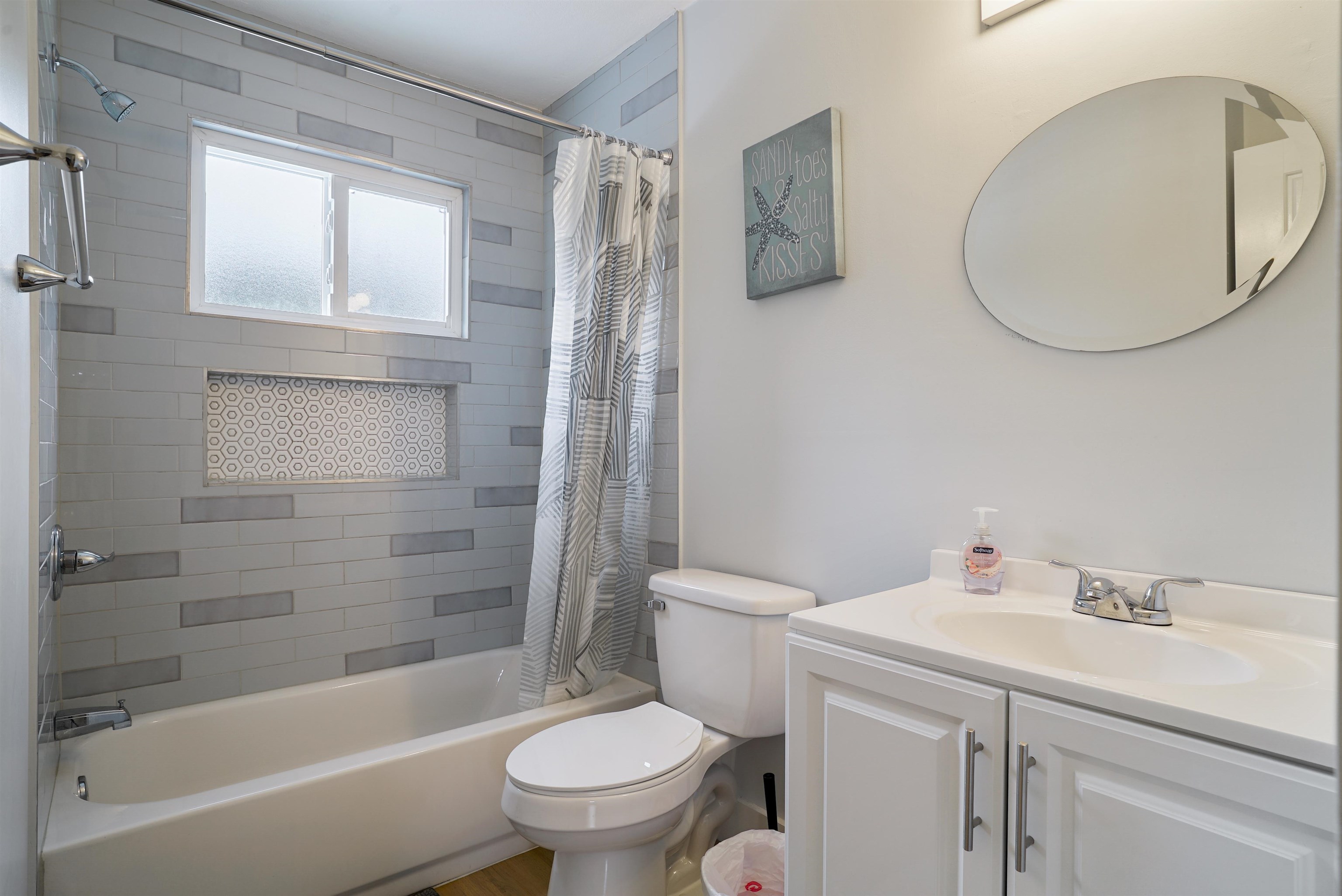 112 E Street St. Augustine, FL 32080 - Photo 17 of 41 a bathroom with a sink toilet and shower