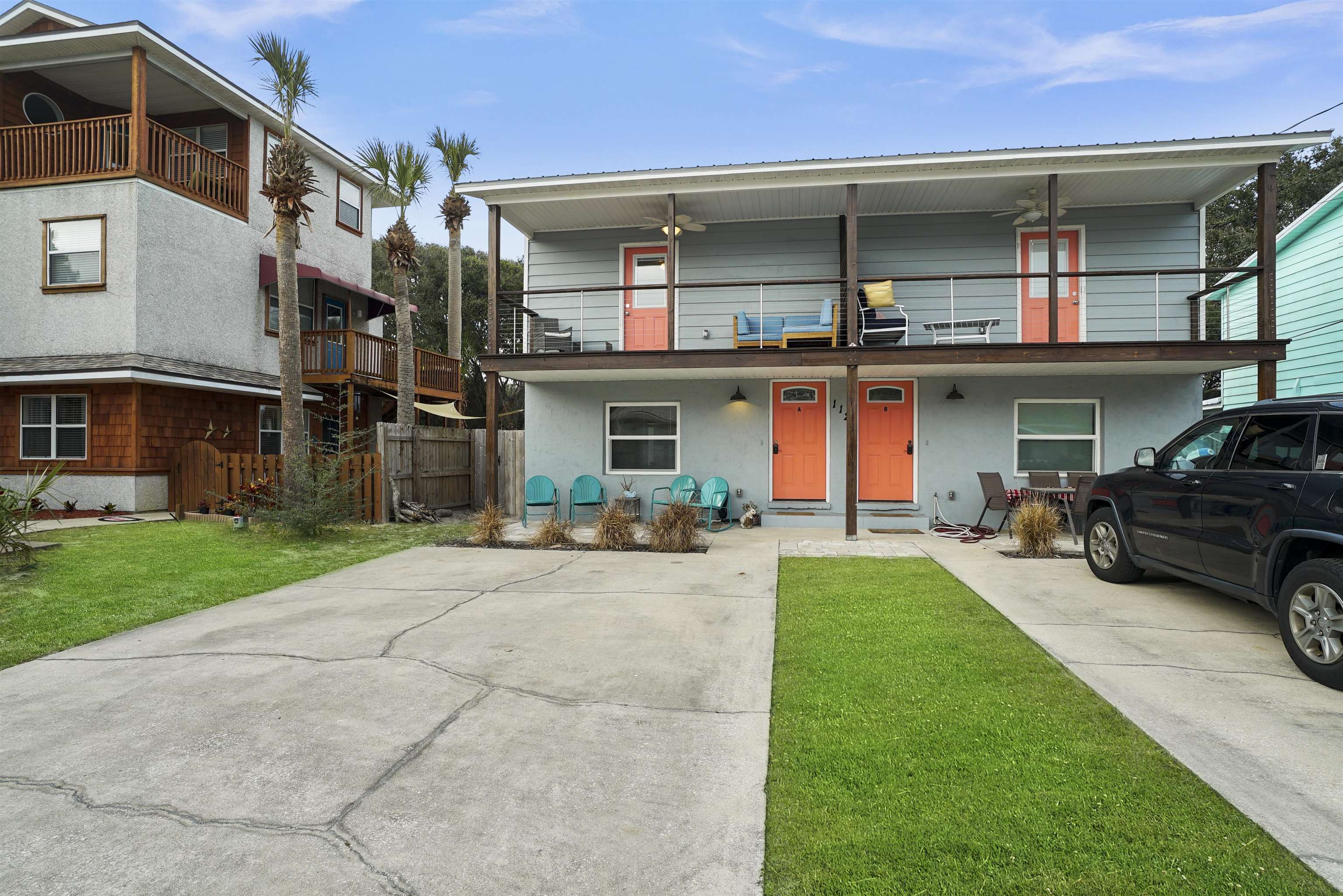 112 E Street St. Augustine, FL 32080 - Photo 19 of 41 a front view of a house with garage and parking