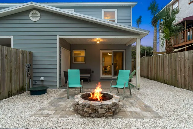 a view of a building with sitting area and entertaining space