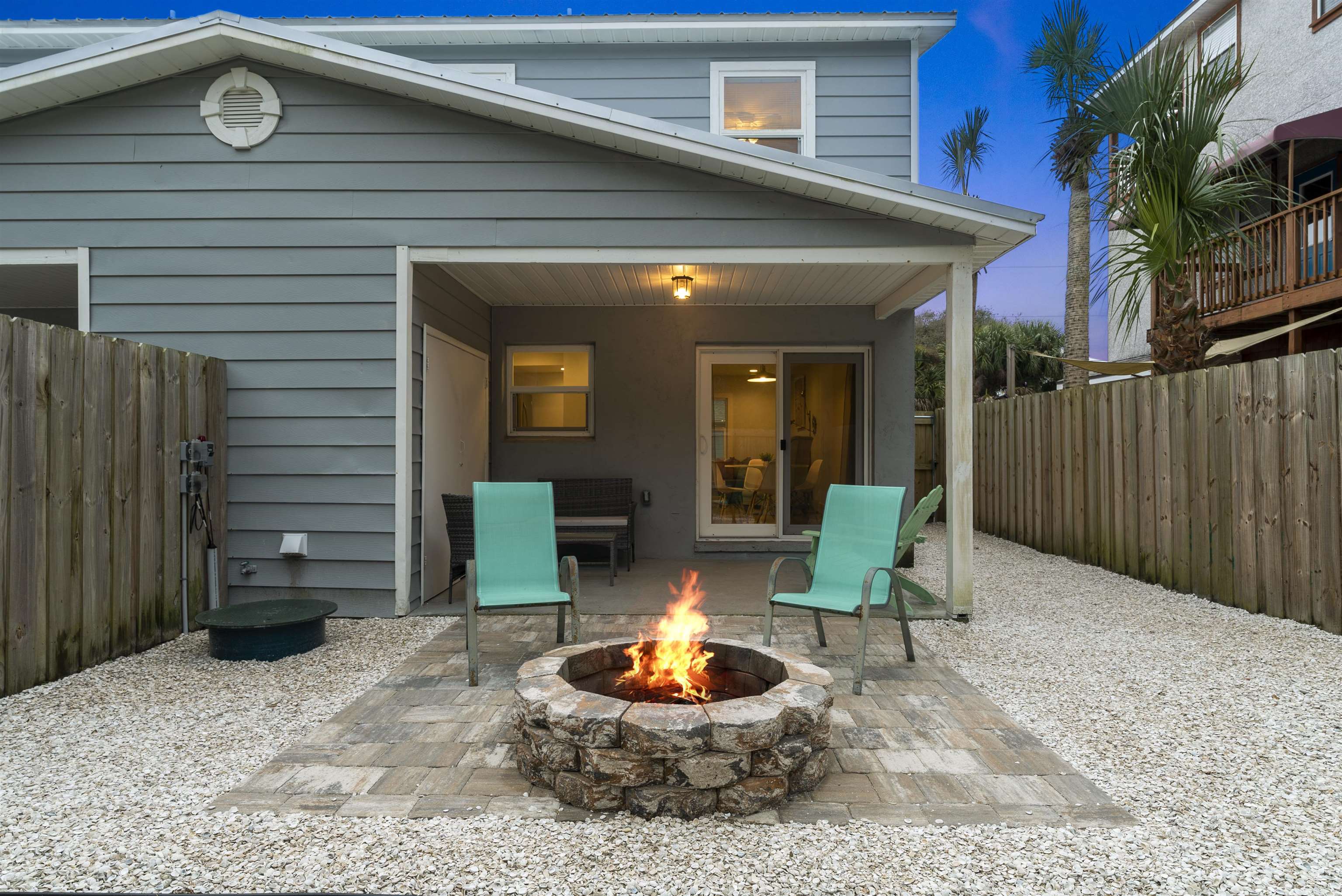 112 E Street St. Augustine, FL 32080 - Photo 22 of 41 a backyard of a house with yard and outdoor seating